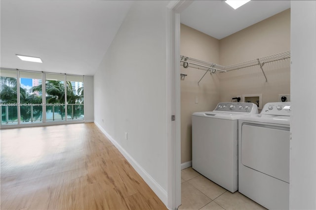 washroom featuring light hardwood / wood-style flooring and independent washer and dryer