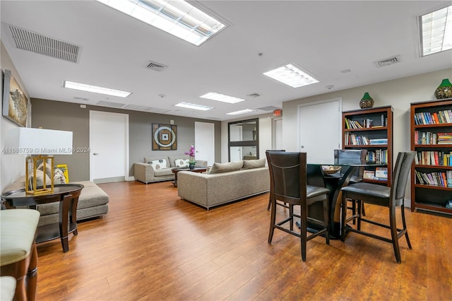 dining space featuring hardwood / wood-style floors