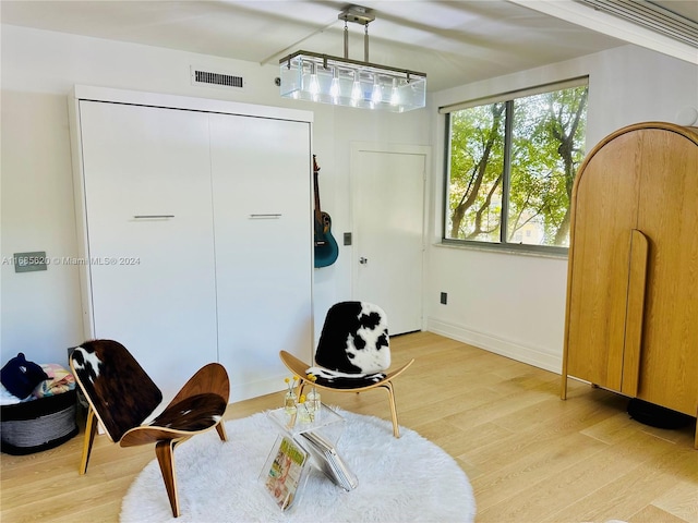 living area with light hardwood / wood-style floors