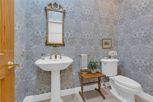 bathroom with tile patterned flooring and toilet