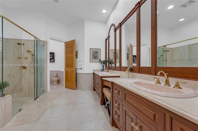 bathroom featuring walk in shower, vanity, a bidet, and tile patterned flooring