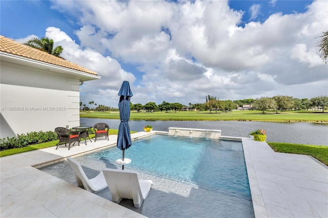 view of pool featuring pool water feature, a patio area, and a water view