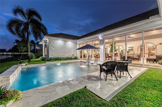 view of swimming pool featuring a patio area