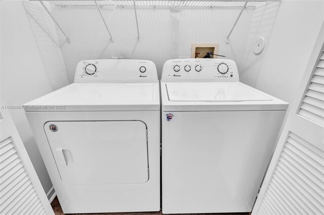 clothes washing area with washing machine and clothes dryer