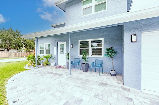 entrance to property with a patio area