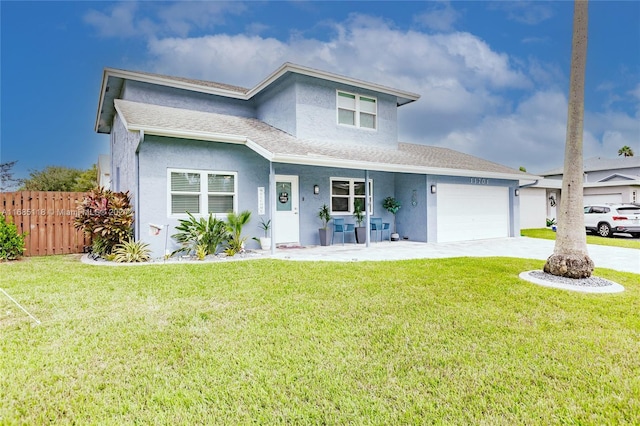 front facade featuring a garage and a front lawn