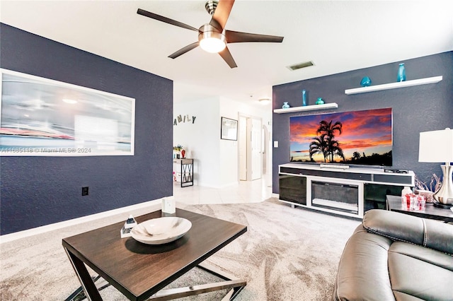 living room with light carpet and ceiling fan