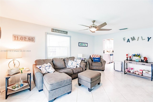 tiled living room featuring ceiling fan