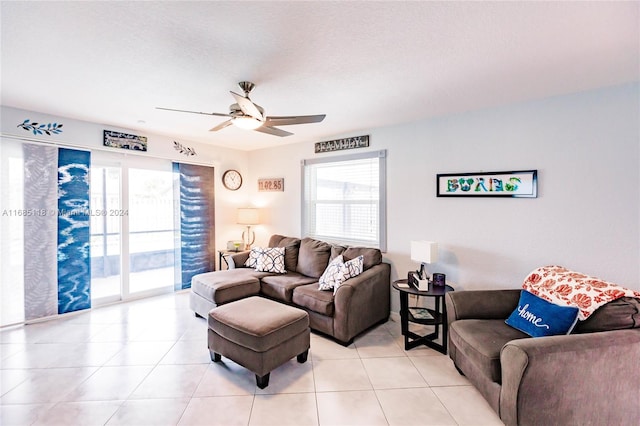 tiled living room featuring a textured ceiling and ceiling fan