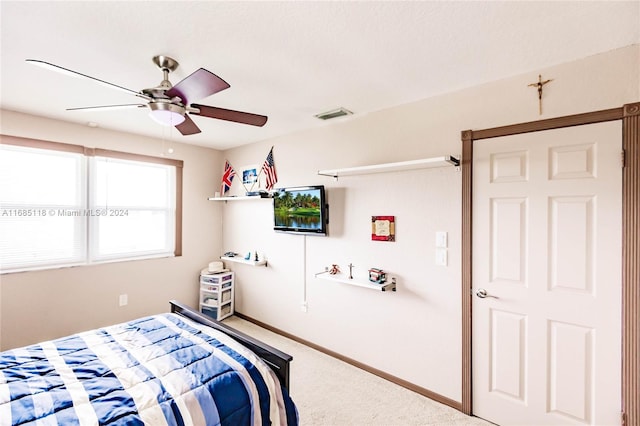 bedroom with ceiling fan and carpet flooring