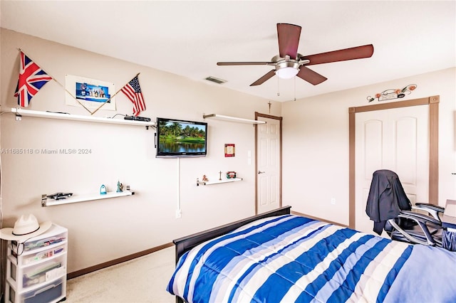 carpeted bedroom featuring ceiling fan