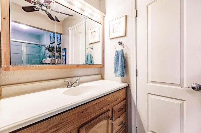 bathroom featuring ceiling fan and vanity