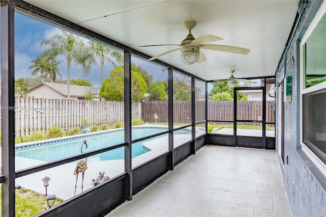 sunroom / solarium featuring ceiling fan and plenty of natural light