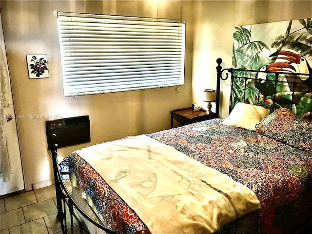 tiled bedroom with multiple windows