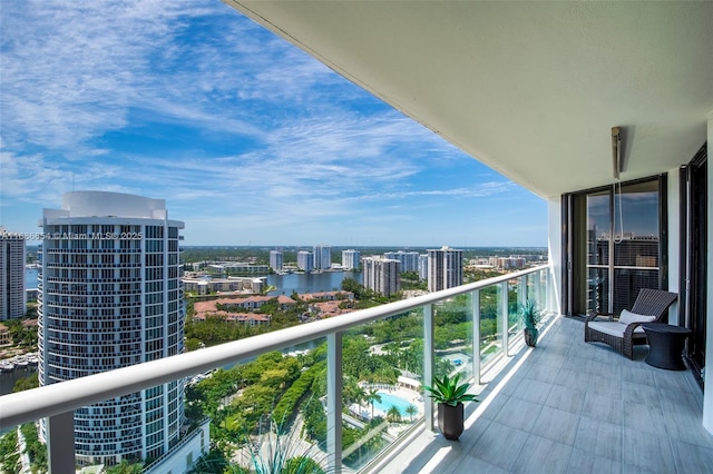 balcony featuring a water view