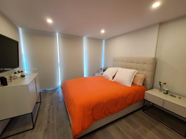 bedroom with hardwood / wood-style flooring