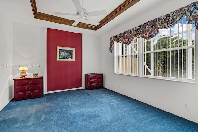 interior space featuring ceiling fan, a raised ceiling, and crown molding