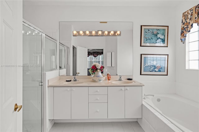 bathroom featuring plenty of natural light, tile patterned flooring, vanity, and shower with separate bathtub