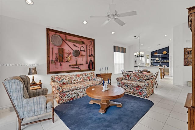 tiled living room featuring ceiling fan with notable chandelier and lofted ceiling