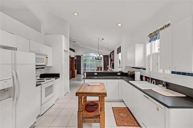 kitchen with white appliances, white cabinetry, light tile patterned floors, sink, and decorative light fixtures