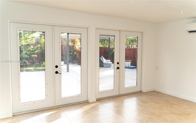 doorway to outside with french doors, light tile patterned flooring, and a wall mounted air conditioner