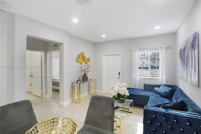 tiled living room featuring radiator