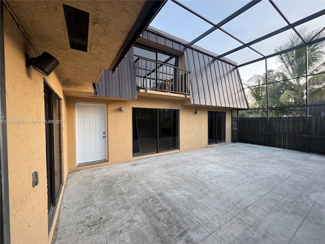 view of patio / terrace with a lanai