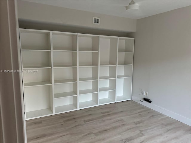 laundry area with light hardwood / wood-style floors