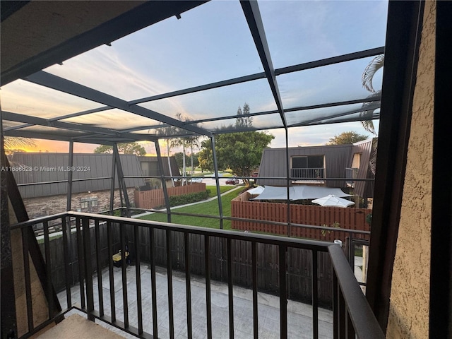 view of balcony at dusk