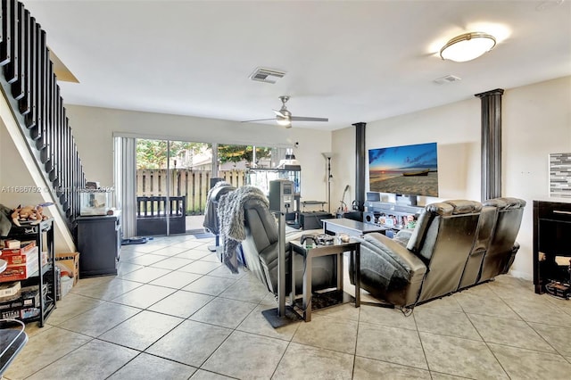 living room with ceiling fan and light tile patterned flooring