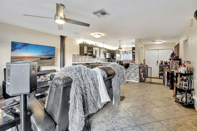 tiled dining area featuring ceiling fan