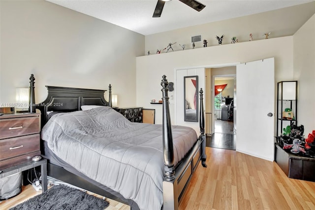 bedroom with ceiling fan and light hardwood / wood-style floors