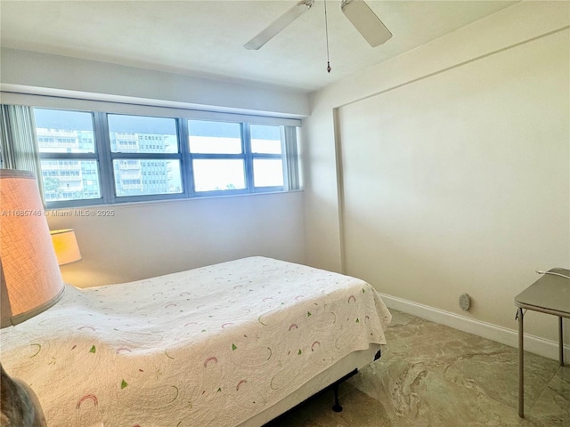 bedroom with multiple windows and ceiling fan