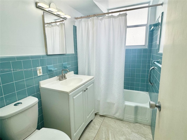 full bathroom featuring vanity, toilet, shower / tub combo, and tile walls