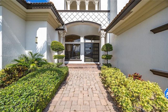 view of exterior entry featuring french doors