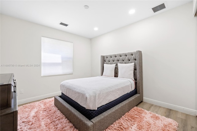 bedroom with light hardwood / wood-style floors