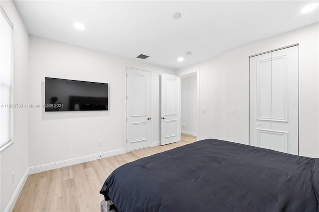 bedroom featuring light wood-type flooring