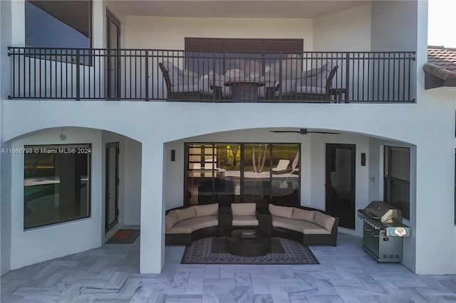 view of patio / terrace with a balcony, area for grilling, and outdoor lounge area