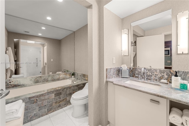 full bathroom with vanity, separate shower and tub, toilet, and tile patterned flooring