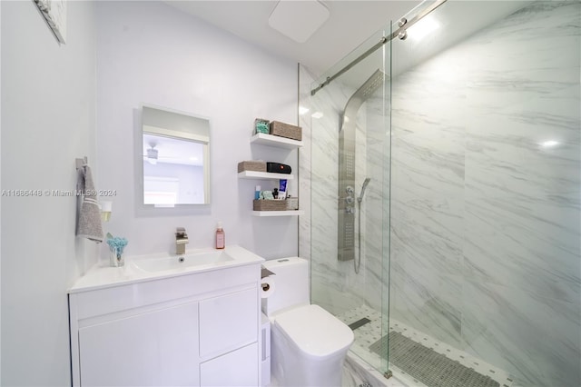 bathroom with vanity, toilet, and walk in shower