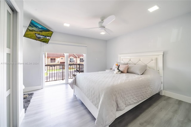 bedroom featuring ceiling fan, hardwood / wood-style floors, and access to exterior