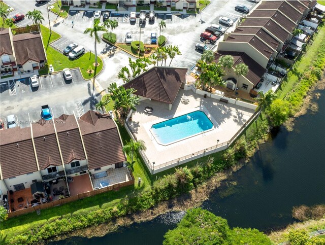 birds eye view of property featuring a water view