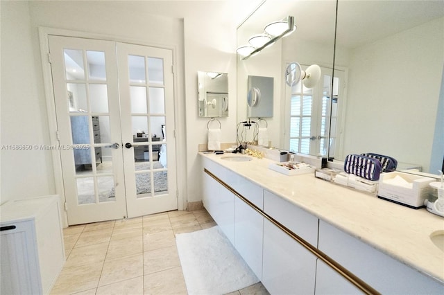 bathroom featuring french doors, tile patterned floors, and vanity