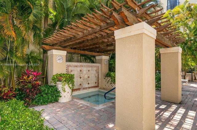 view of swimming pool featuring a patio area and a pergola