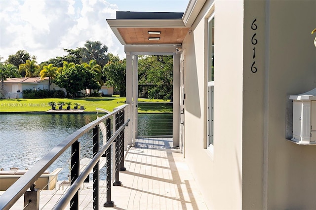 6616 E Miami Lakes Dr E, Miami Lakes, FL 33014 - dock with a water view and a lawn