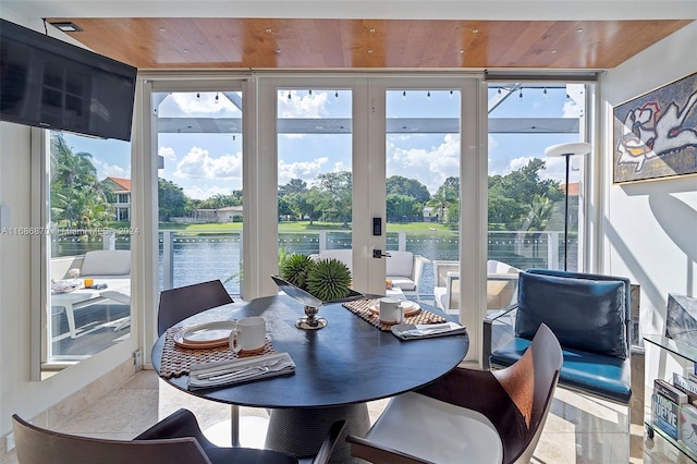 6616 E Miami Lakes Dr E, Miami Lakes, FL 33014 - dining space with wood ceiling, a water view, floor to ceiling windows, and french doors