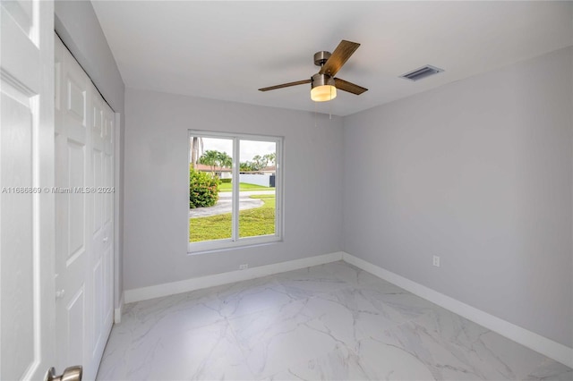 unfurnished room with ceiling fan