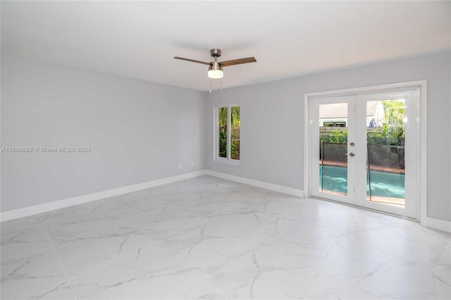 spare room featuring french doors and ceiling fan