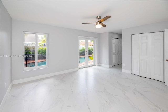 unfurnished bedroom featuring access to outside, ceiling fan, and french doors