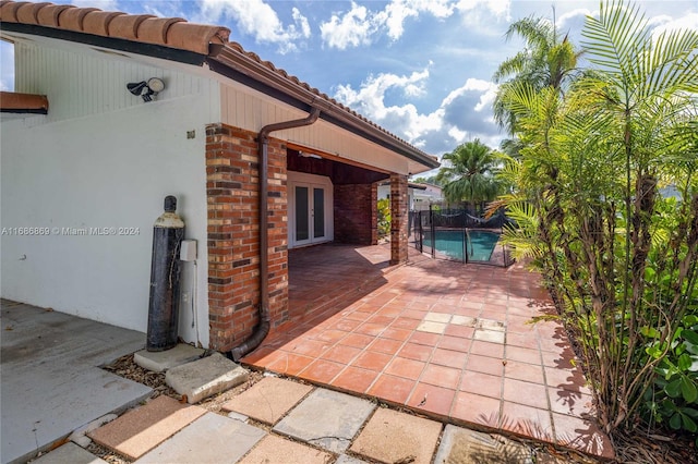 view of patio featuring french doors